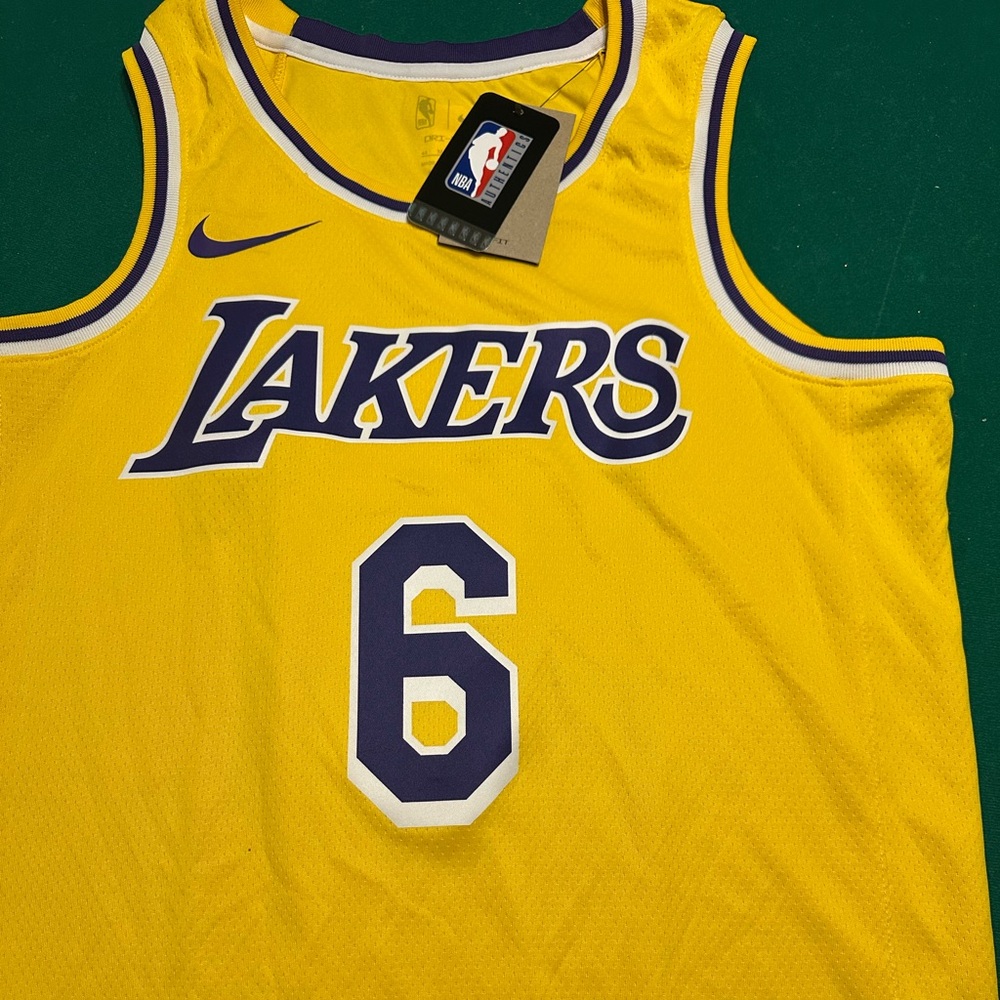 Step up your game with the brand-new Nike Lakers Basketball Jersey 🟡💜